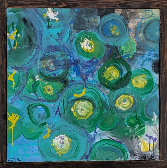 Green and yellow circular forms floating across a blue field.